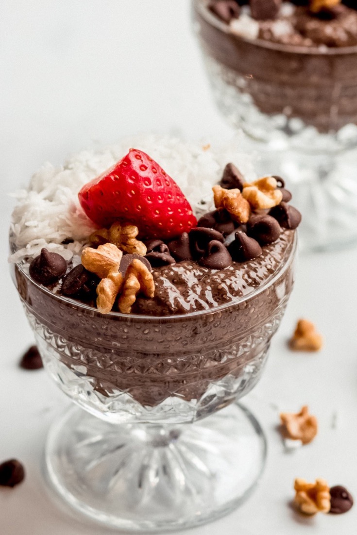 German Chocolate Chia Pudding in glass antique bowls with strawberry on top