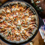 vegetable au gratin with cheese sauce in cast iron skillet